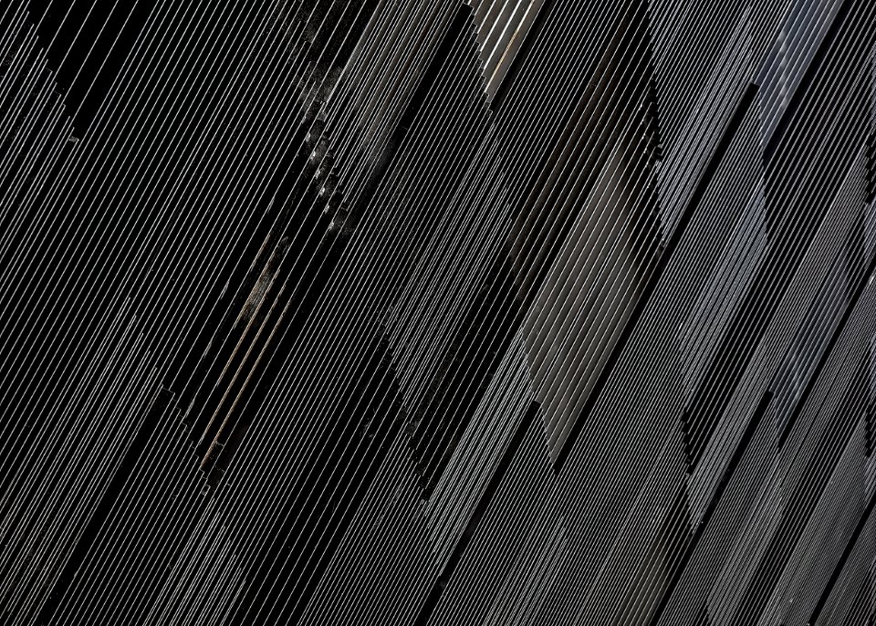 close-up photograph of black concrete wall