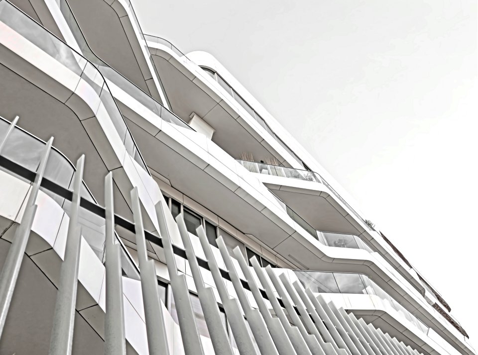 white concrete fence near building