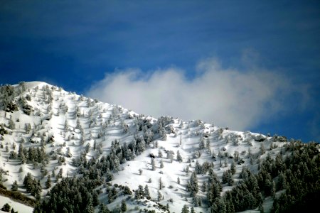 snow-covered mountain under blue sky photo