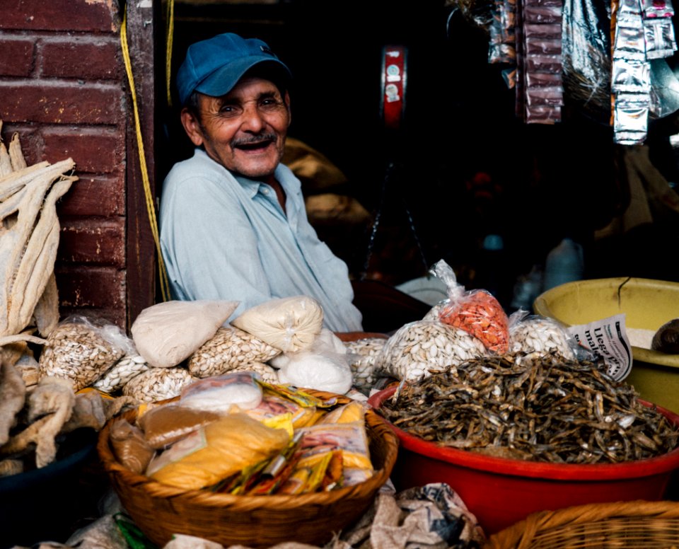 man in blue cap inside store photo