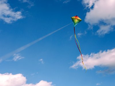 green and yellow kite on air