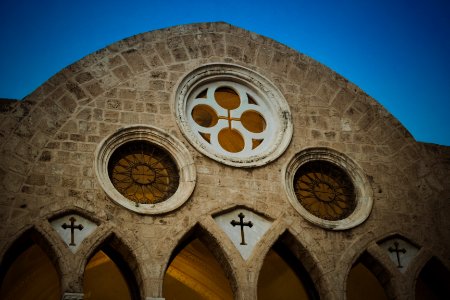 A closeup of the top of a large church.