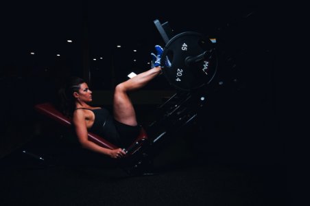 woman on gym equipment photo