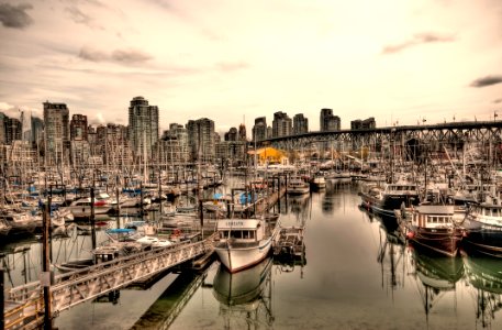 white boat by the dock photo