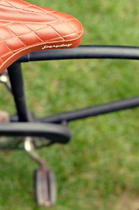 selective focus photography of brown Everyday leather bicycle saddle photo