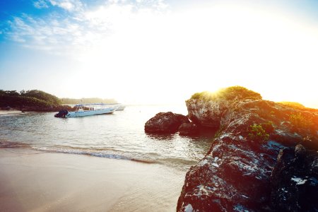 white boat near seashore during daytime photo