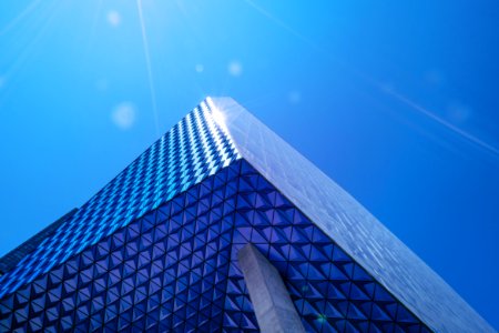 curtain-wall high rise building under blue sky photo