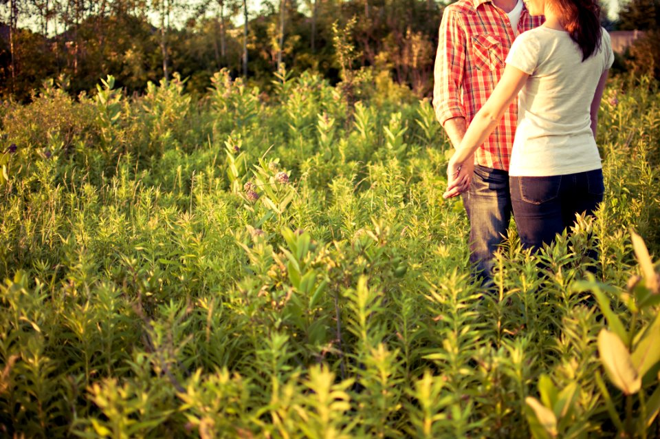 couple in grass field