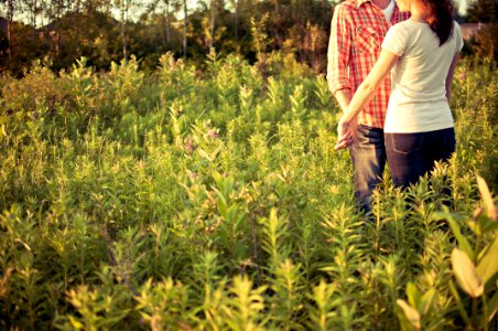 couple in grass field