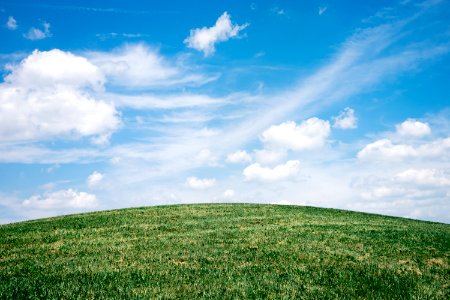 landscape of grass field under blue sky photo