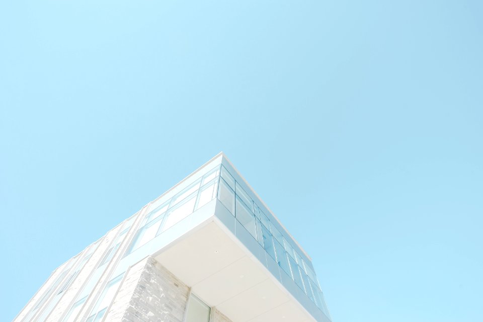 low angle photograph of white concrete building