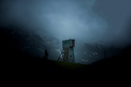 white watch tower on mountain photo