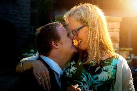 smiling couple kissing during daytime