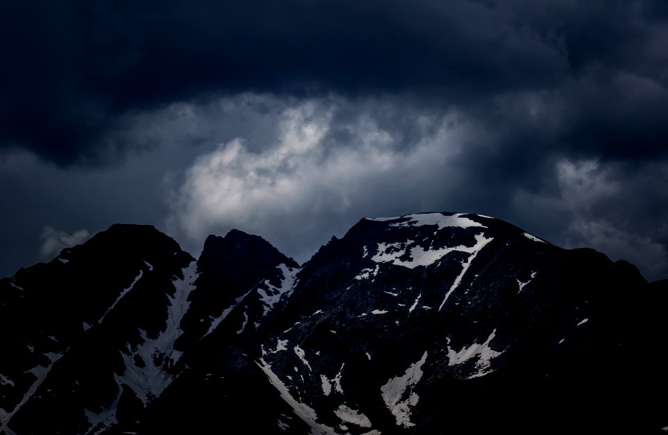 mountain alps under stratocumulus clouds