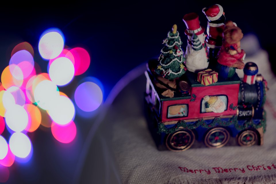 shallow focus photo fo red, blue, and green train figurine
