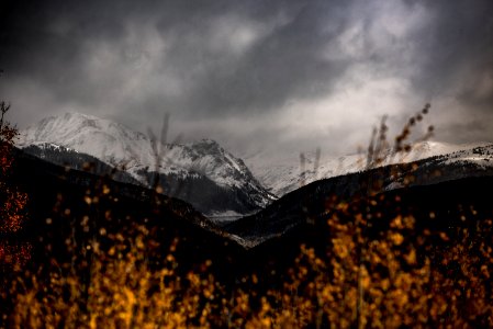 snow mountain covered by dark clouds photo