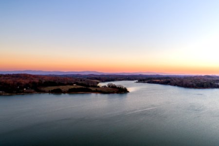 aerial photography of body of water and trees during daytime photo