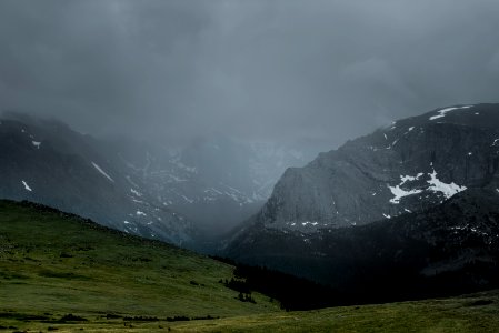 green mountain under cloudy sky photo