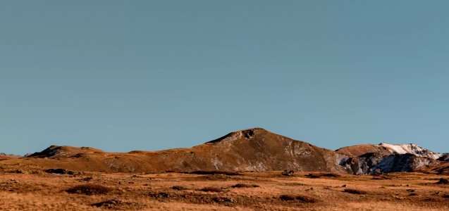 mountain under blue sky photo