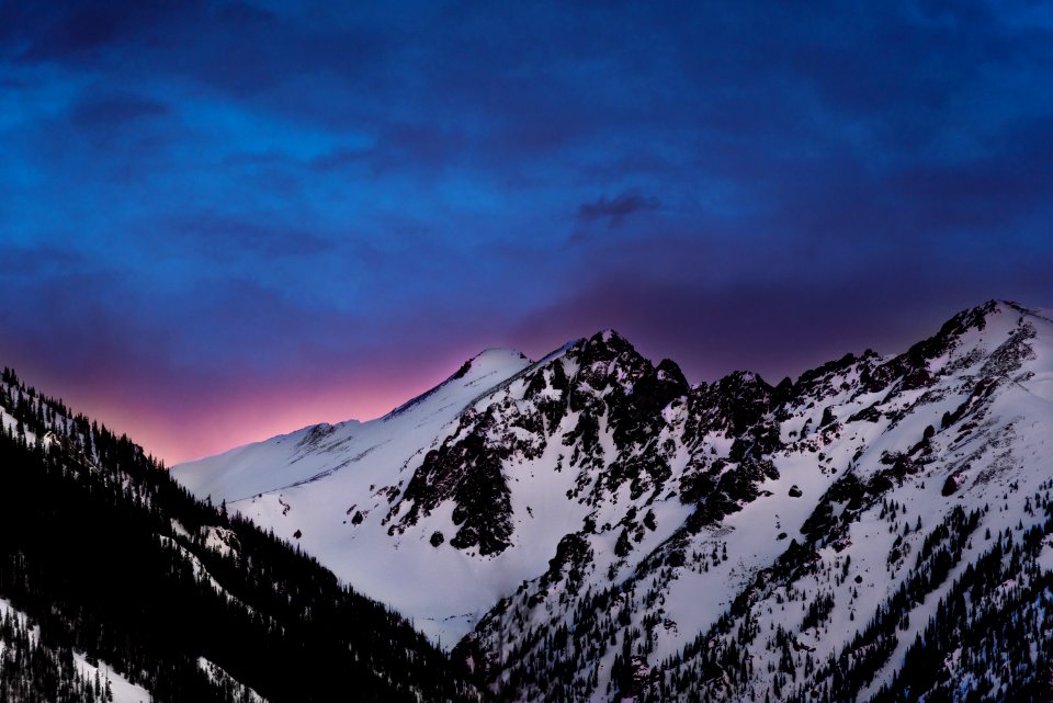 snow covered mountains under blue sky