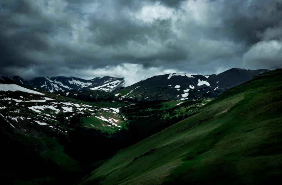 cloudy sky on top of mountains photo