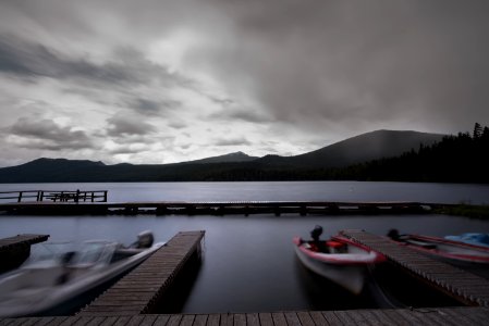 white boat near wooden dock over water photo