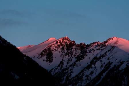 mountain covered in snow at golden hour photo