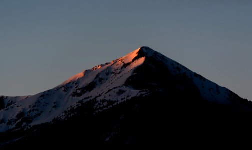 snow-capped mountain under dark sky photo