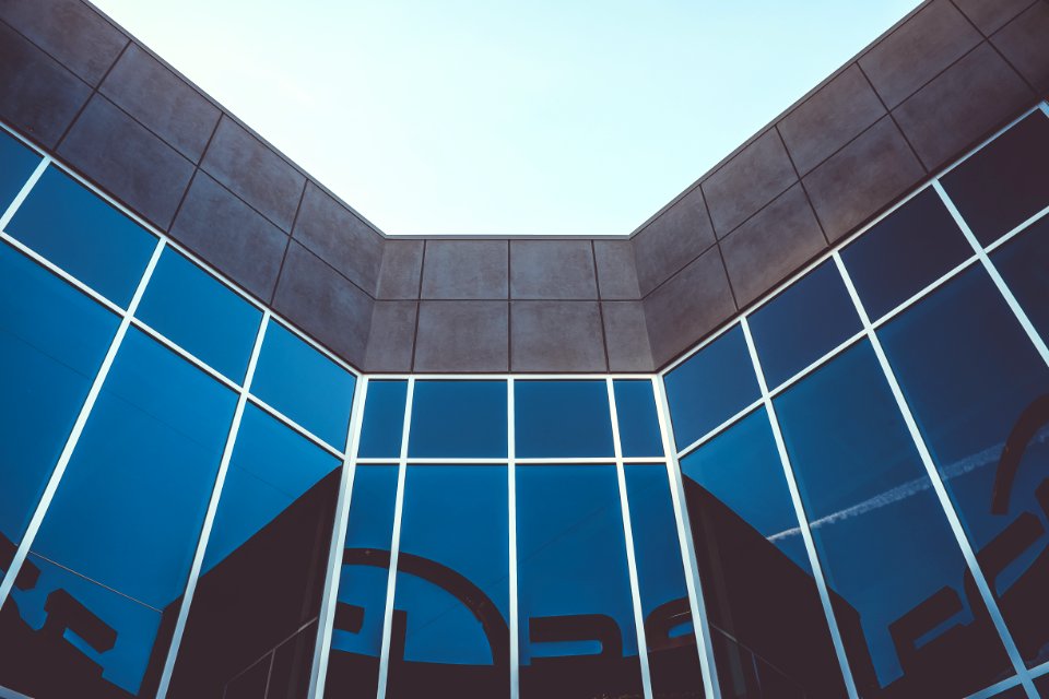 grey building with large glass windows
