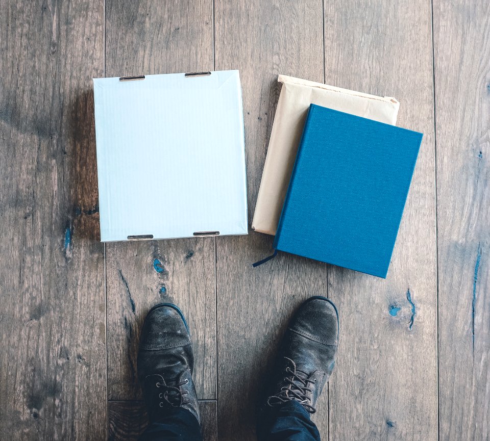 person standing near three boxes