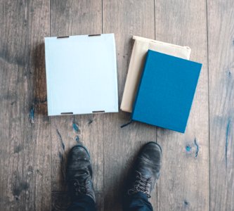person standing near three boxes