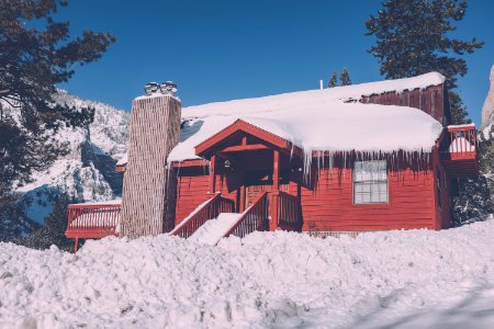 snow capped red building photo