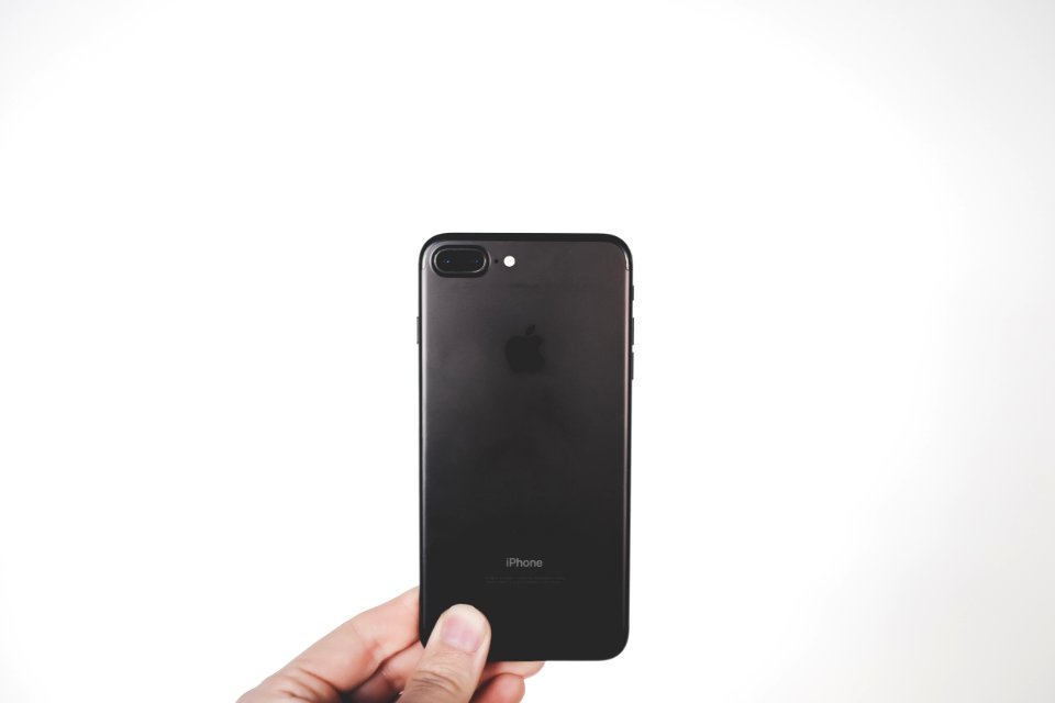 person holding black iPhone 7 Plus