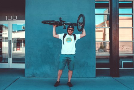 men's white crew-neck t-shirt and blue shorts photo