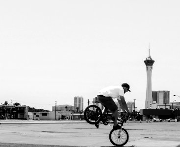 man riding BMX bike doing tricks