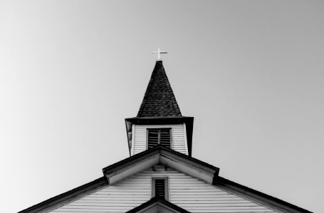 white and black concrete chapel in low angle photography photo