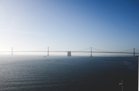 steel bridge under blue sky photo