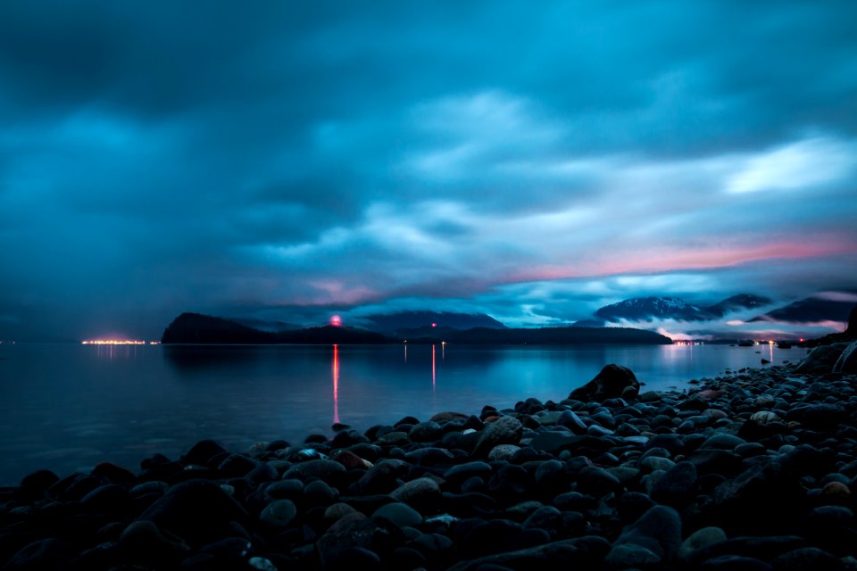 landscape photo of rocks near the body of water