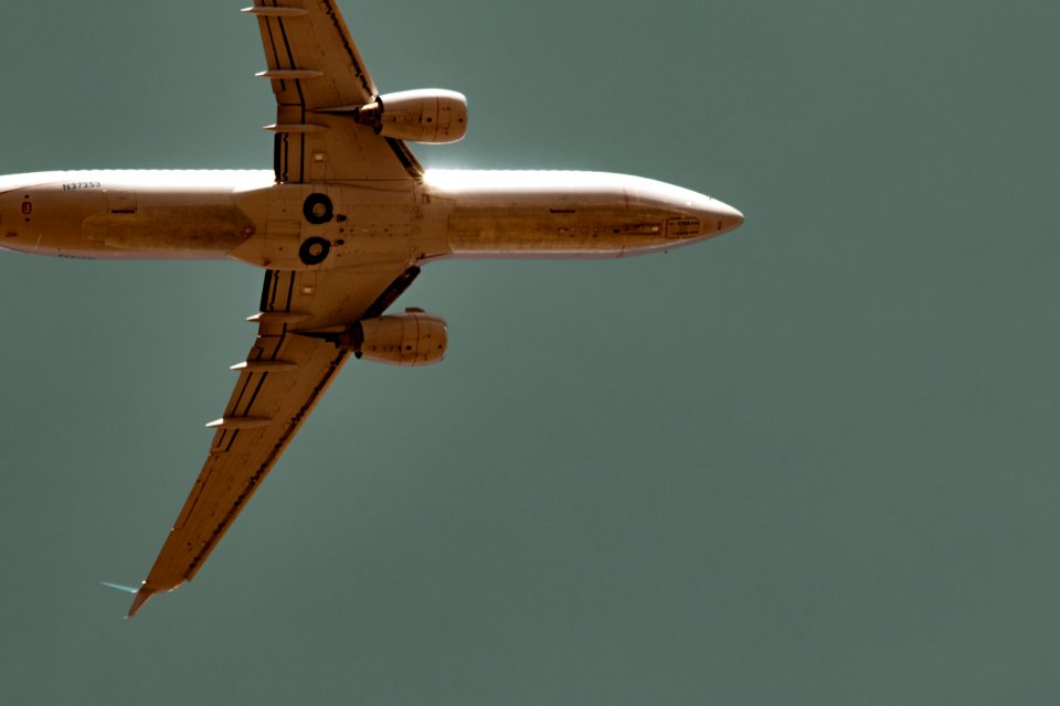 worm's-eye view of commercial airplane in sky