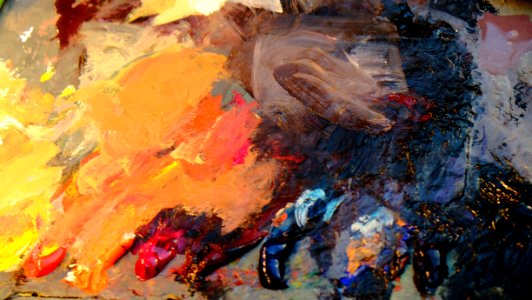 A mess of thick paint of different colors, scattered all over the place.