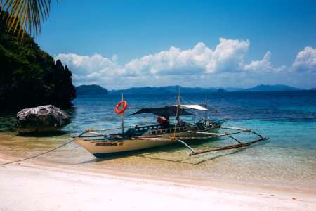 boat near seashore during daytime photo