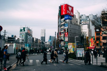 people crossing in pedestrian lane photo