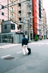 person walking on street during daytime photo