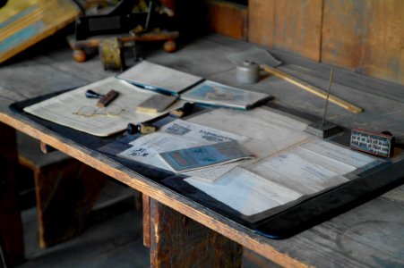 paper on top on table beside ruler