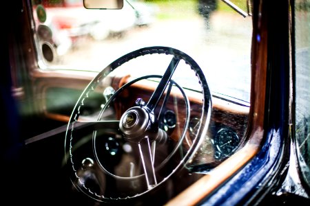 photo of vintage vehicle steering wheel during daytime photo