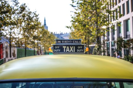 selective focus photography of taxi cab signage photo
