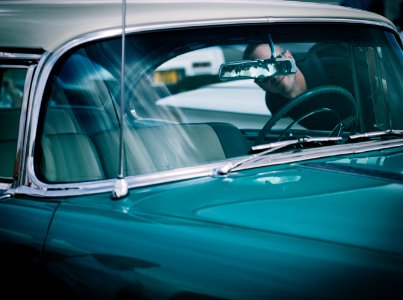 person looking at vehicle interior photo