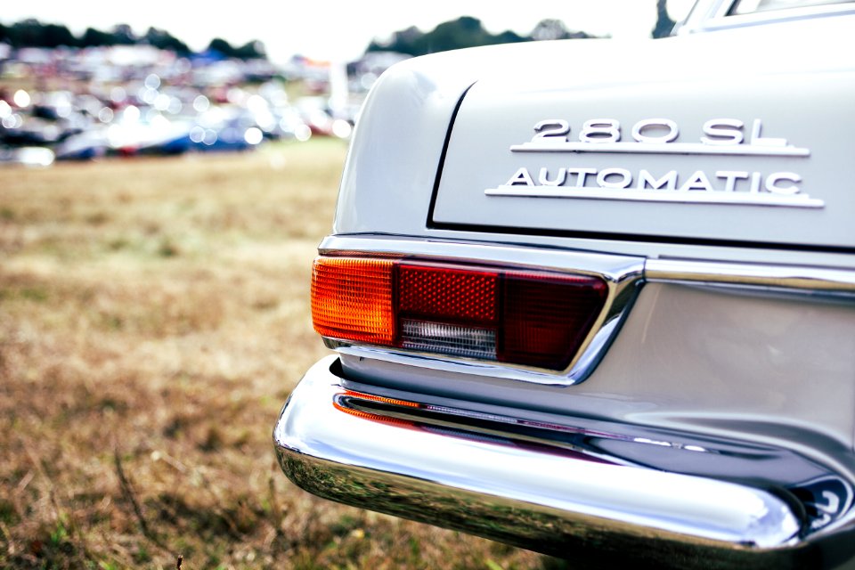 tilt shift lens photo of 280 SL automatic car