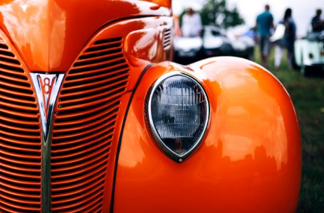 vintage orange car during daytime photo