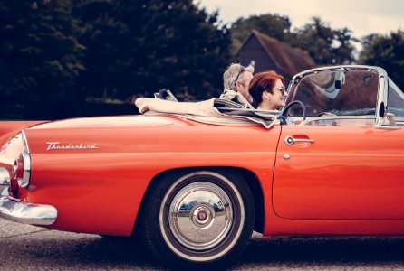 two person riding vintage coupe photo